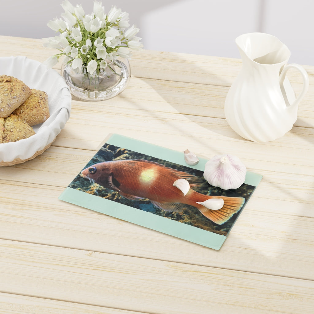 Orange Fish Cutting Board made of tempered glass with rubber dots for stability, featuring a vibrant fish design.