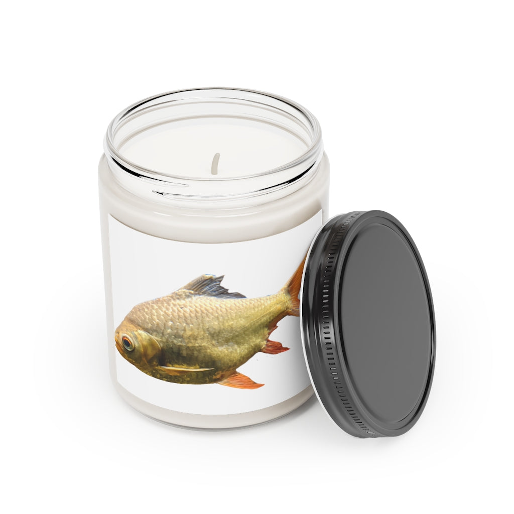 Orange Fish Scented Candle in a glass container, featuring a vibrant orange color and a permanent adhesive label, showcasing its artisanal quality.
