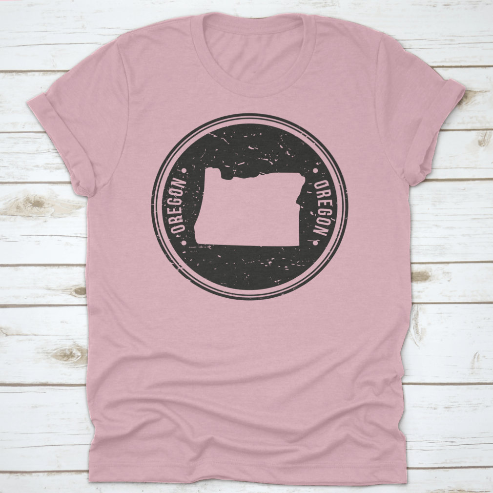 Oregon Map Symbol Round Design Stamp T-Shirt in Sport Grey, showcasing a unique map design.