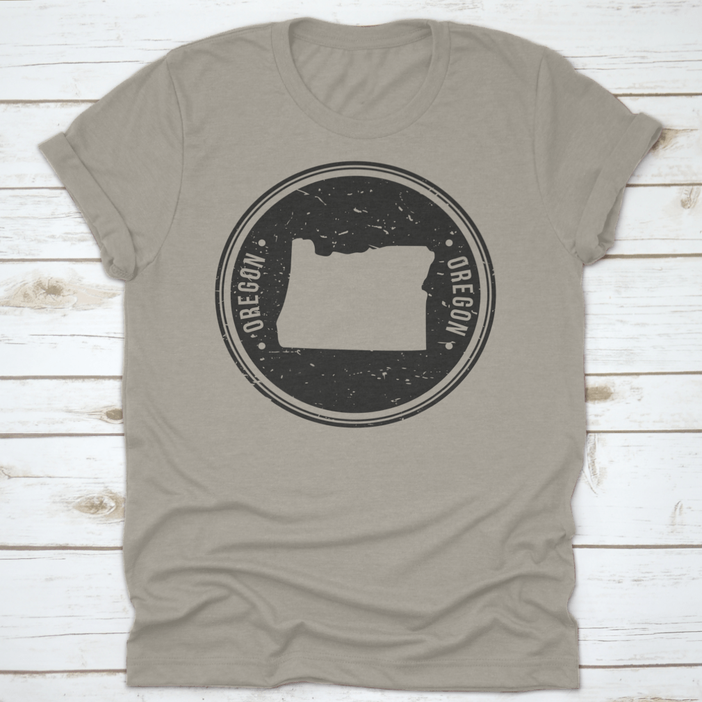 Oregon Map Symbol Round Design Stamp T-Shirt in Sport Grey, showcasing a unique map design.