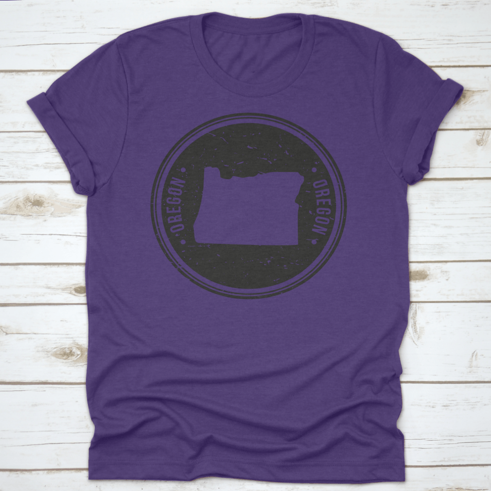 Oregon Map Symbol Round Design Stamp T-Shirt in Sport Grey, showcasing a unique map design.