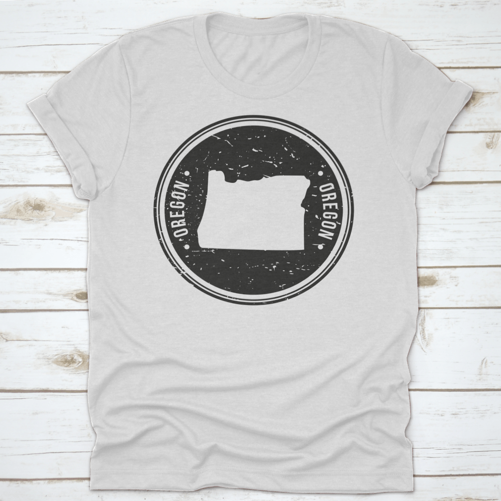 Oregon Map Symbol Round Design Stamp T-Shirt in Sport Grey, showcasing a unique map design.