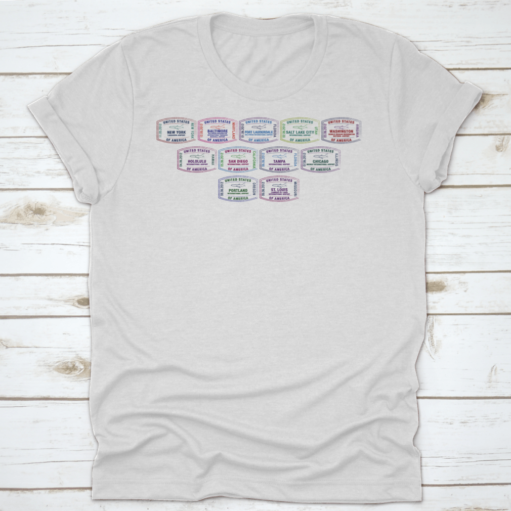 A stylish T-shirt featuring vector prints of passport stamps from major US airports, showcasing travel-themed design.
