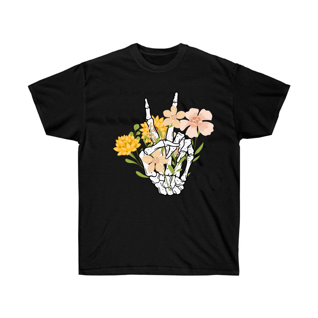 A stylish boho t-shirt featuring a peace hand symbol surrounded by wildflowers, made from 100% soft cotton.