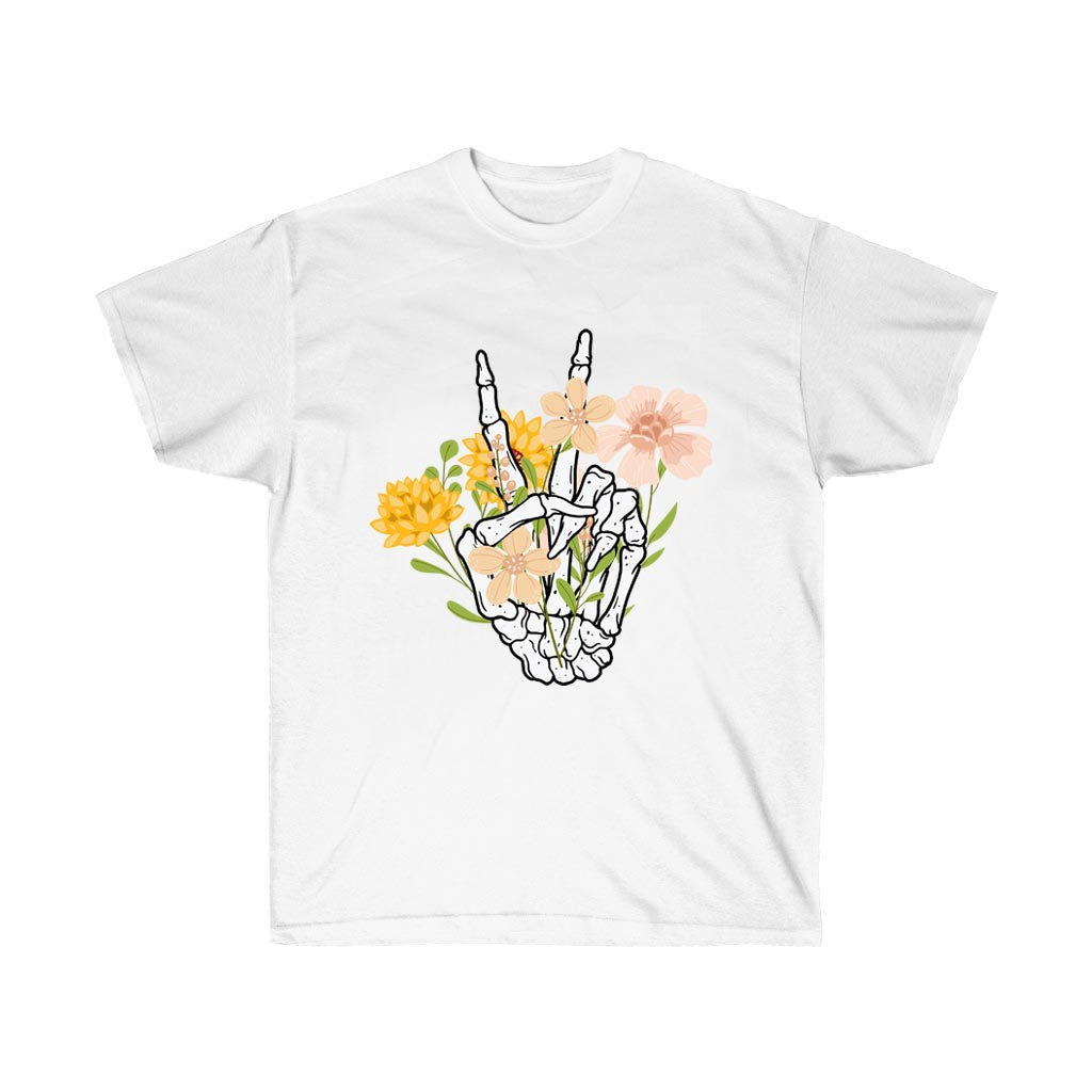 A stylish boho t-shirt featuring a peace hand symbol surrounded by wildflowers, made from 100% soft cotton.