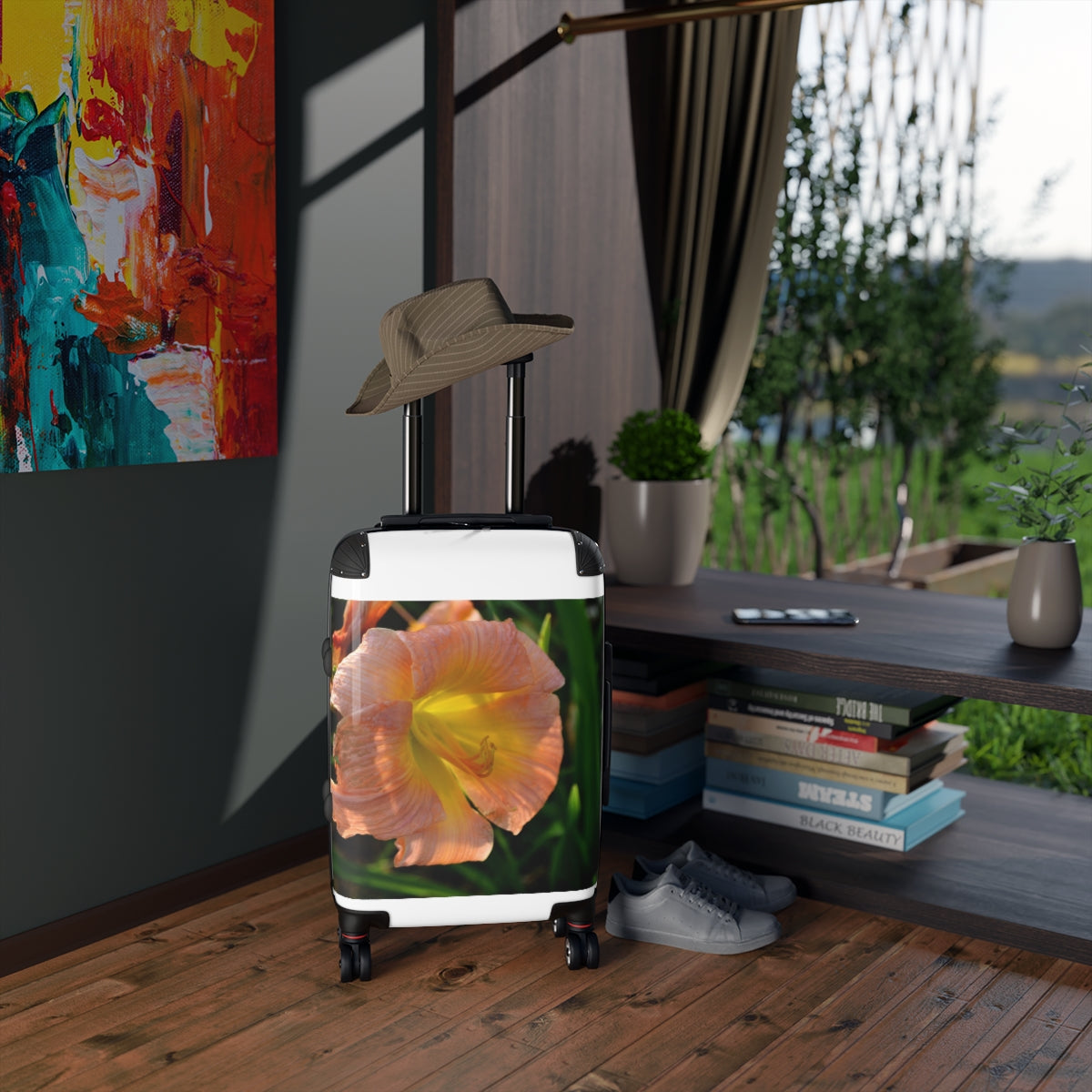 Peach and yellow floral patterned cabin suitcase with adjustable handle and wheels, perfect for stylish travel.