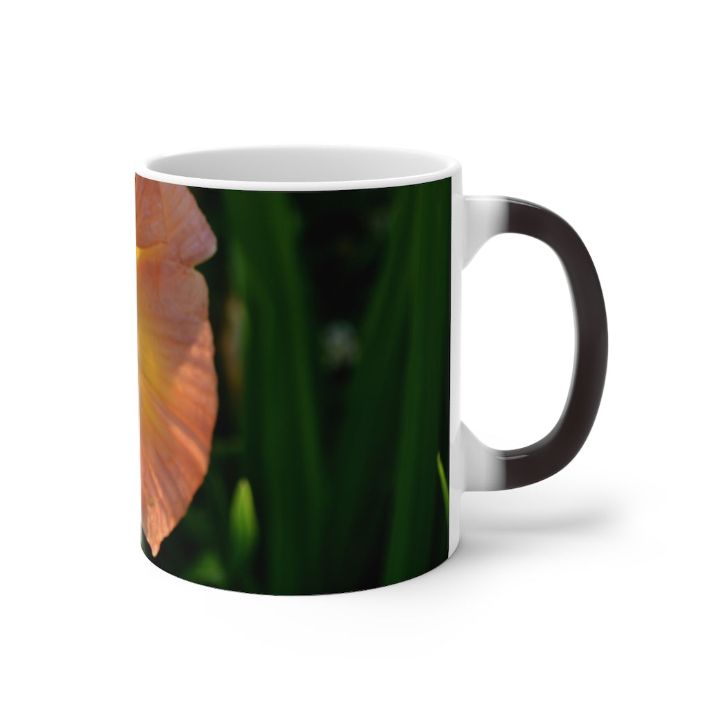 Peach and yellow flower color changing mug with rounded corners and C-handle, showcasing vibrant floral design.