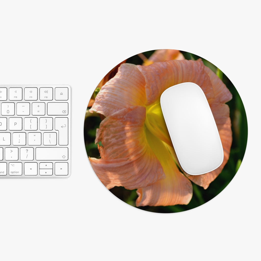 Peach and yellow flower mouse pad with vibrant floral design, available in round and rectangular shapes, featuring a non-slip rubber bottom.