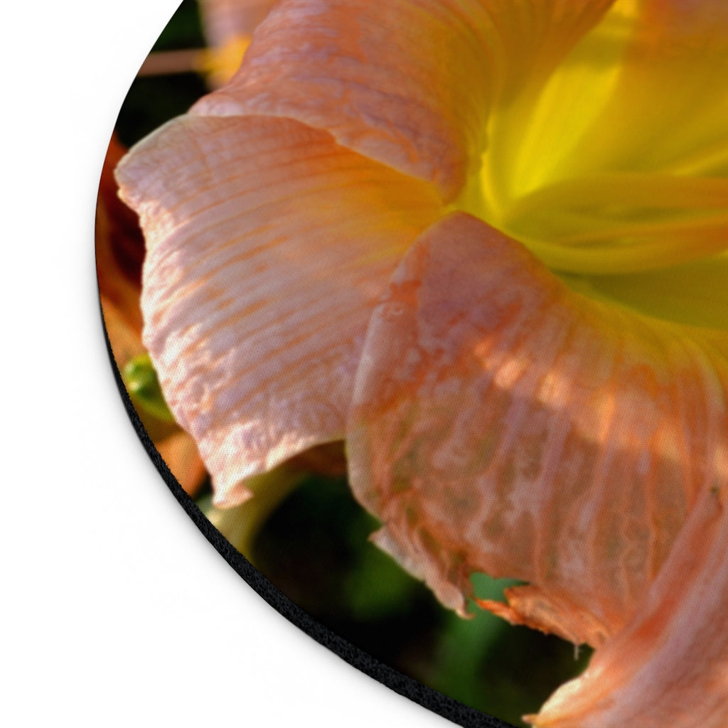 Peach and yellow flower mouse pad with vibrant floral design, available in round and rectangular shapes, featuring a non-slip rubber bottom.