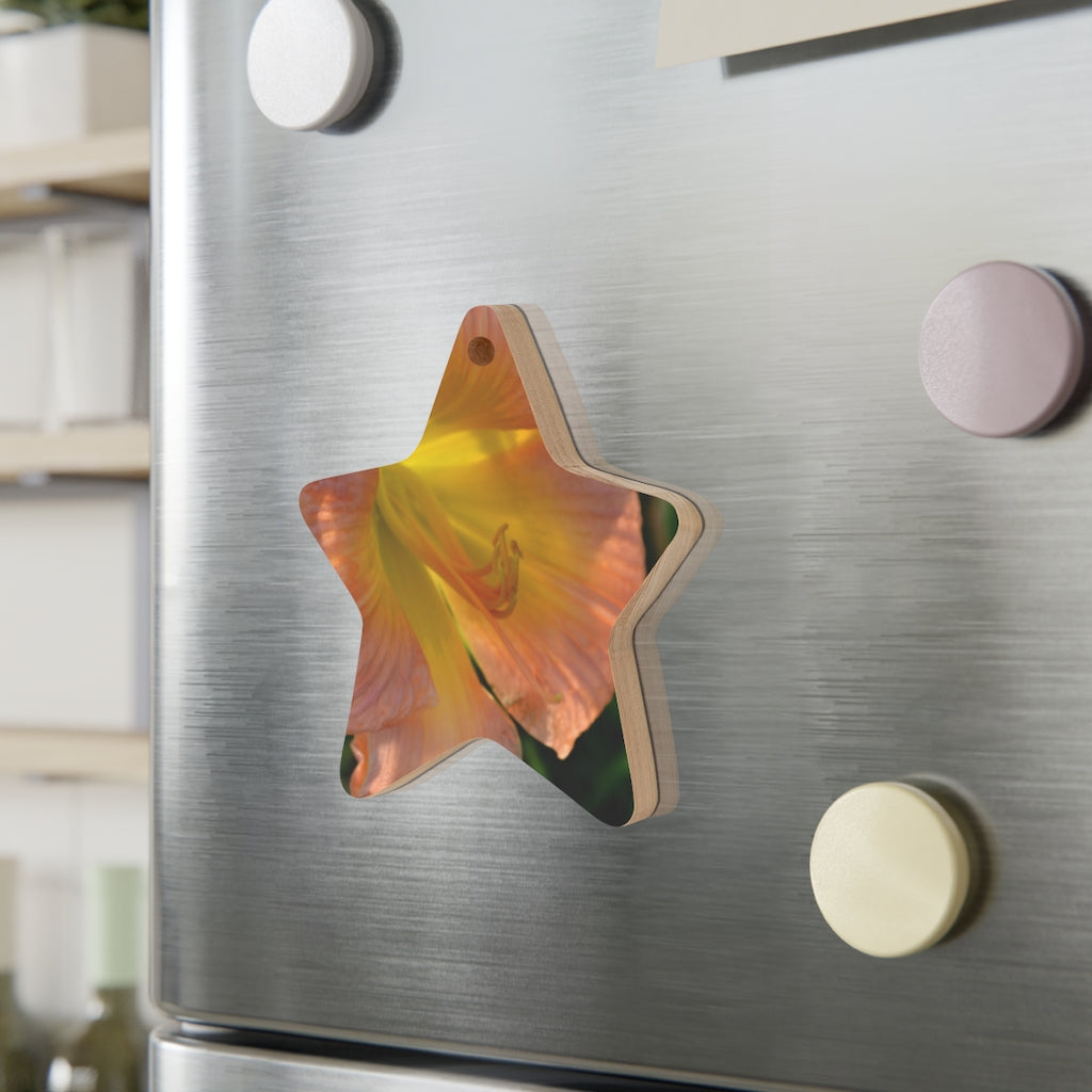 Peach and yellow flower wooden Christmas ornaments with red ribbons, showcasing whimsical shapes and a rustic design.