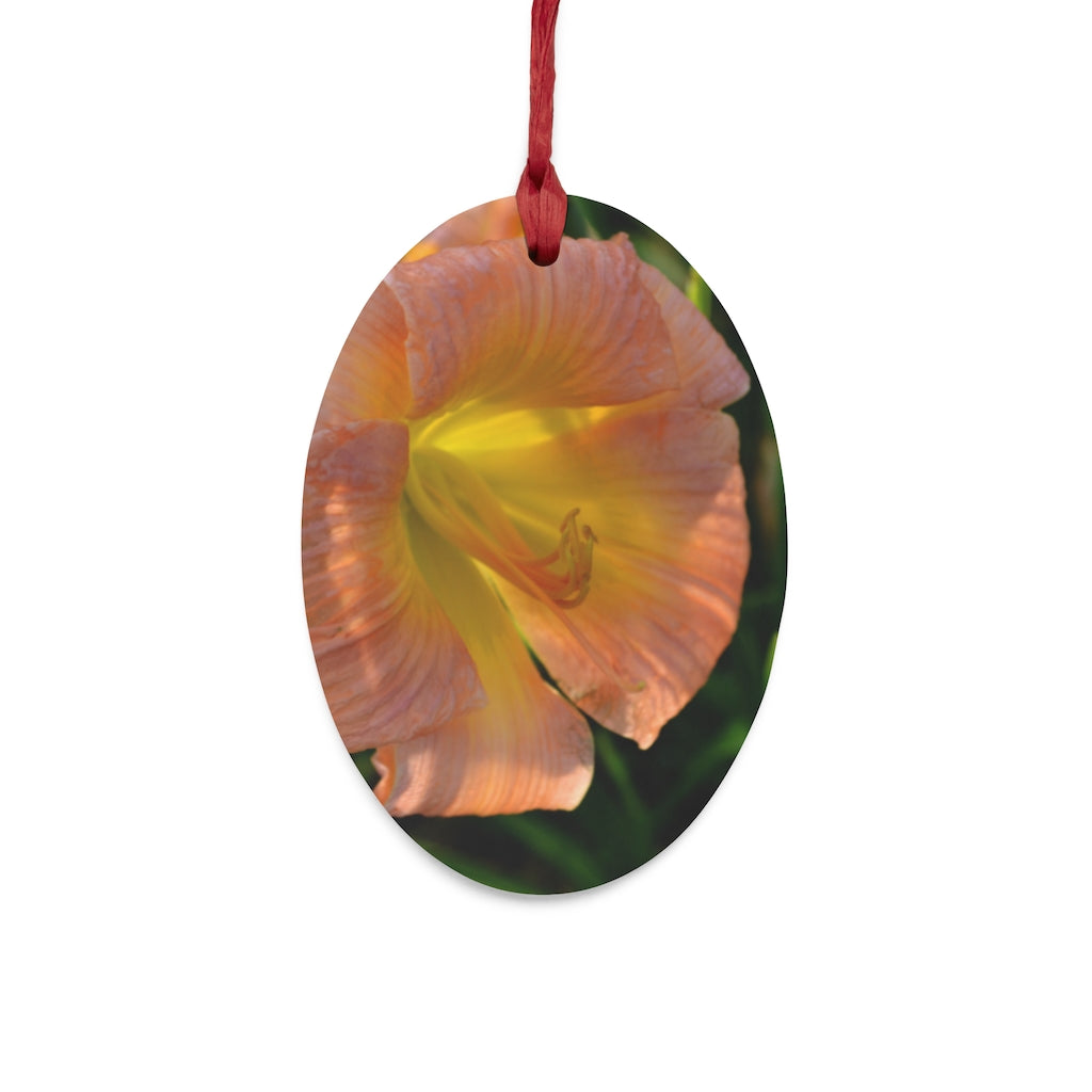 Peach and yellow flower wooden Christmas ornaments with red ribbons, showcasing whimsical shapes and a rustic design.