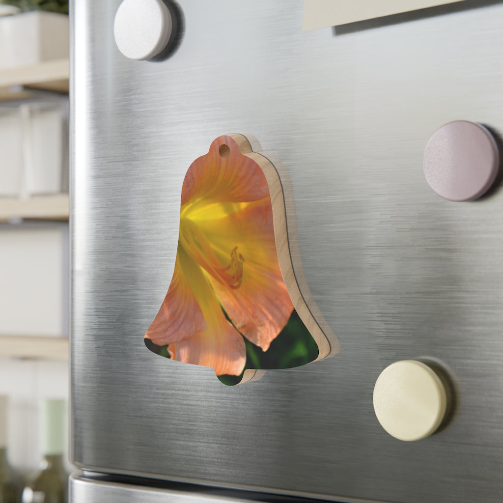 Peach and yellow flower wooden Christmas ornaments with red ribbons, showcasing whimsical shapes and a rustic design.