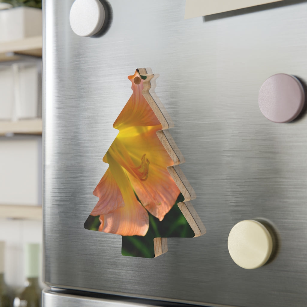 Peach and yellow flower wooden Christmas ornaments with red ribbons, showcasing whimsical shapes and a rustic design.