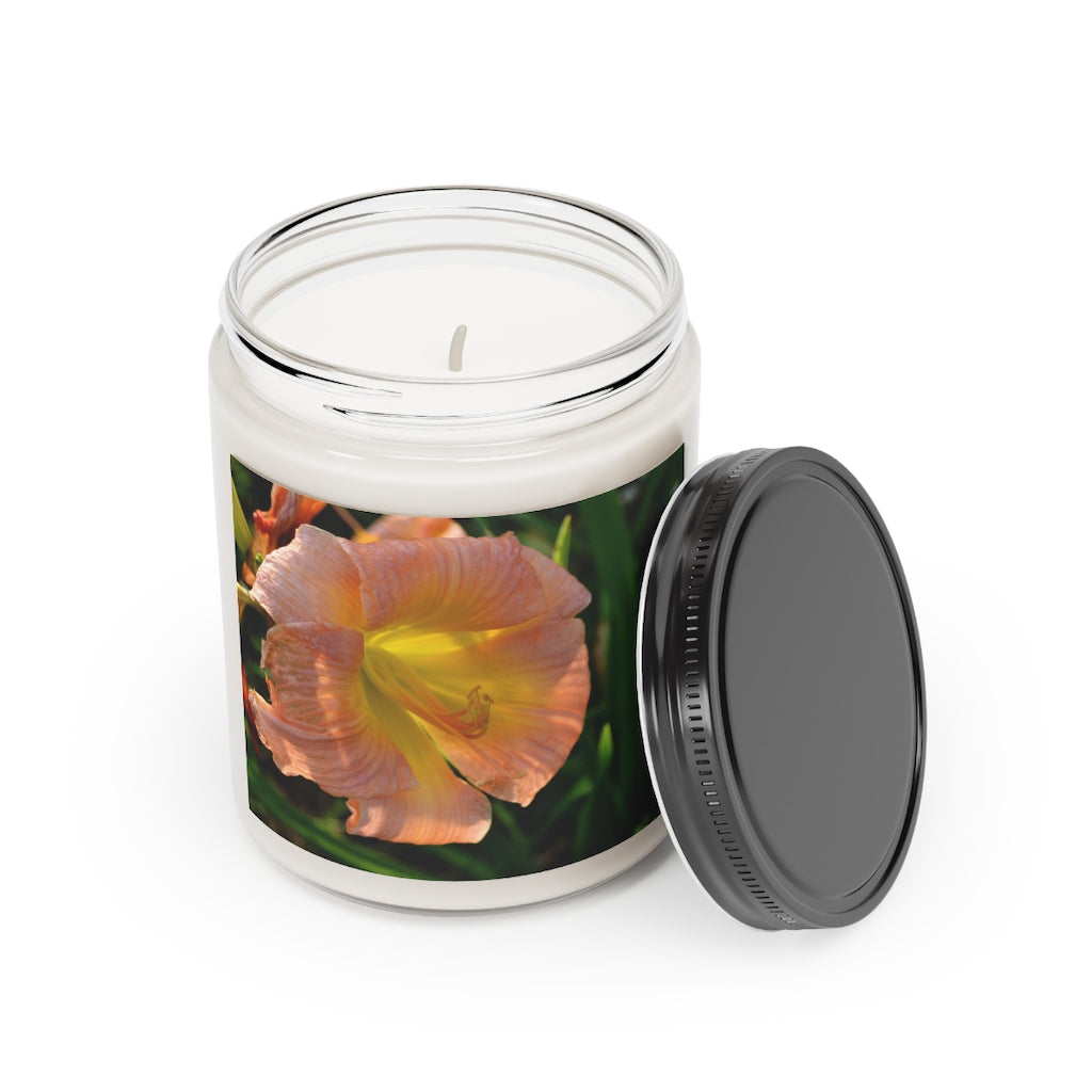 A beautifully hand-poured Peach Flower Scented Candle in a glass container, showcasing its elegant design and vibrant color.