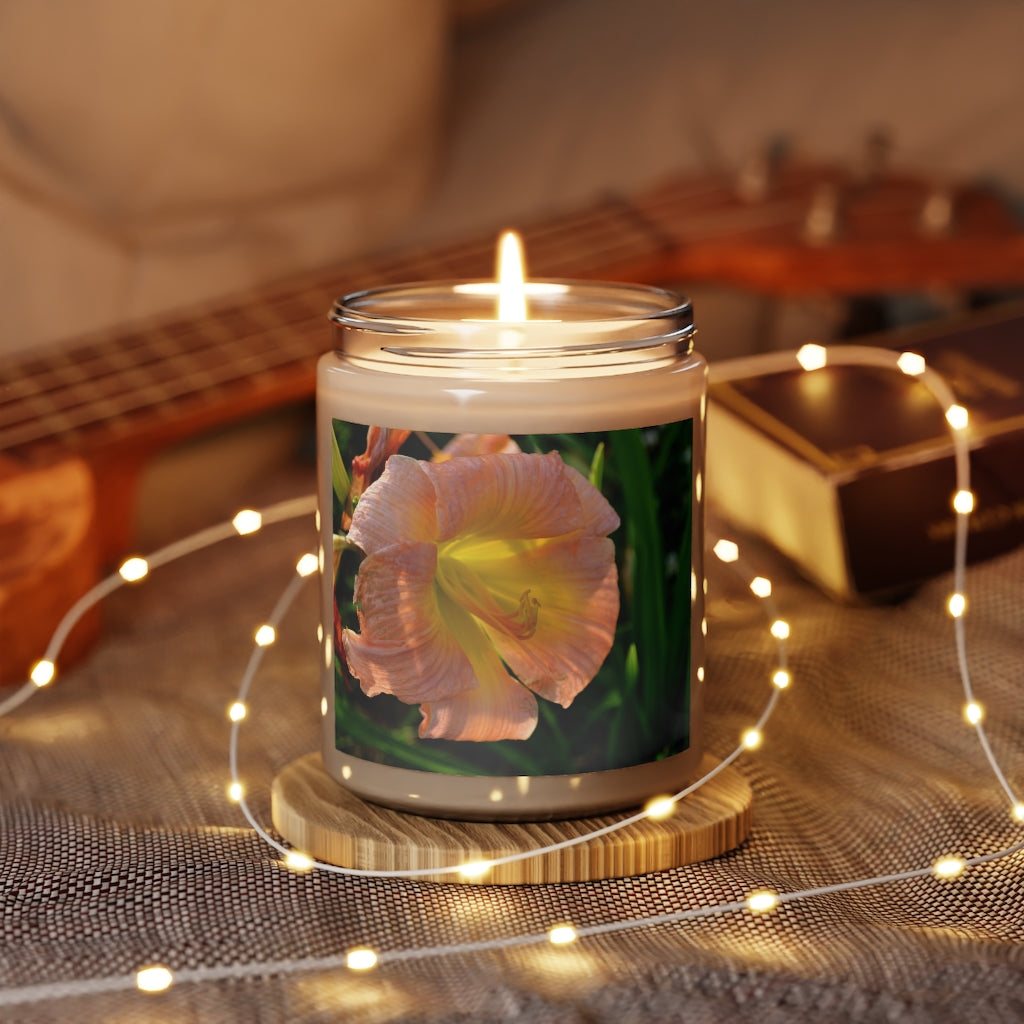 A beautifully hand-poured Peach Flower Scented Candle in a glass container, showcasing its elegant design and vibrant color.