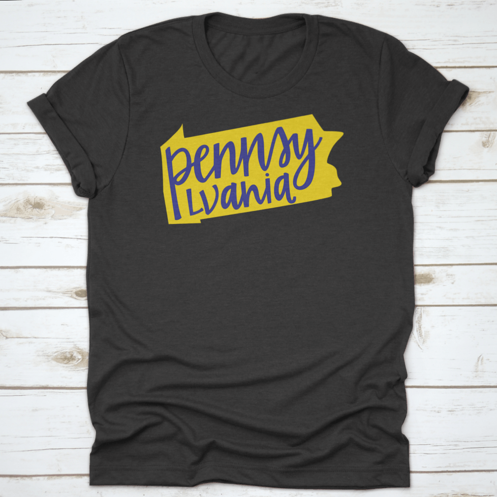 A stylish T-shirt featuring the Pennsylvania state outline and hand lettering design, made from soft cotton fabric.