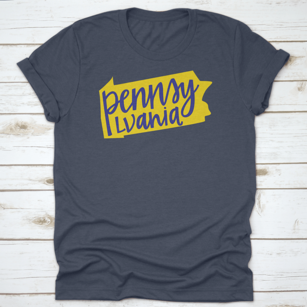 A stylish T-shirt featuring the Pennsylvania state outline and hand lettering design, made from soft cotton fabric.