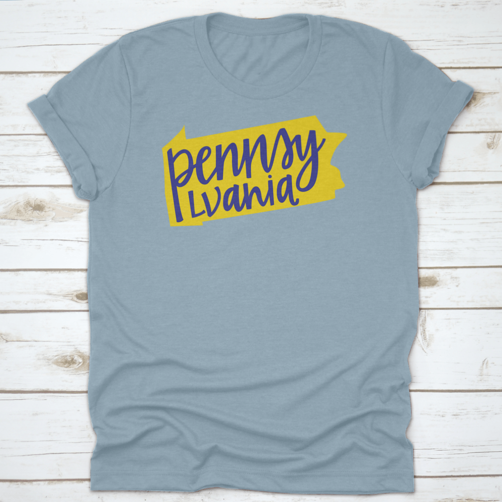 A stylish T-shirt featuring the Pennsylvania state outline and hand lettering design, made from soft cotton fabric.
