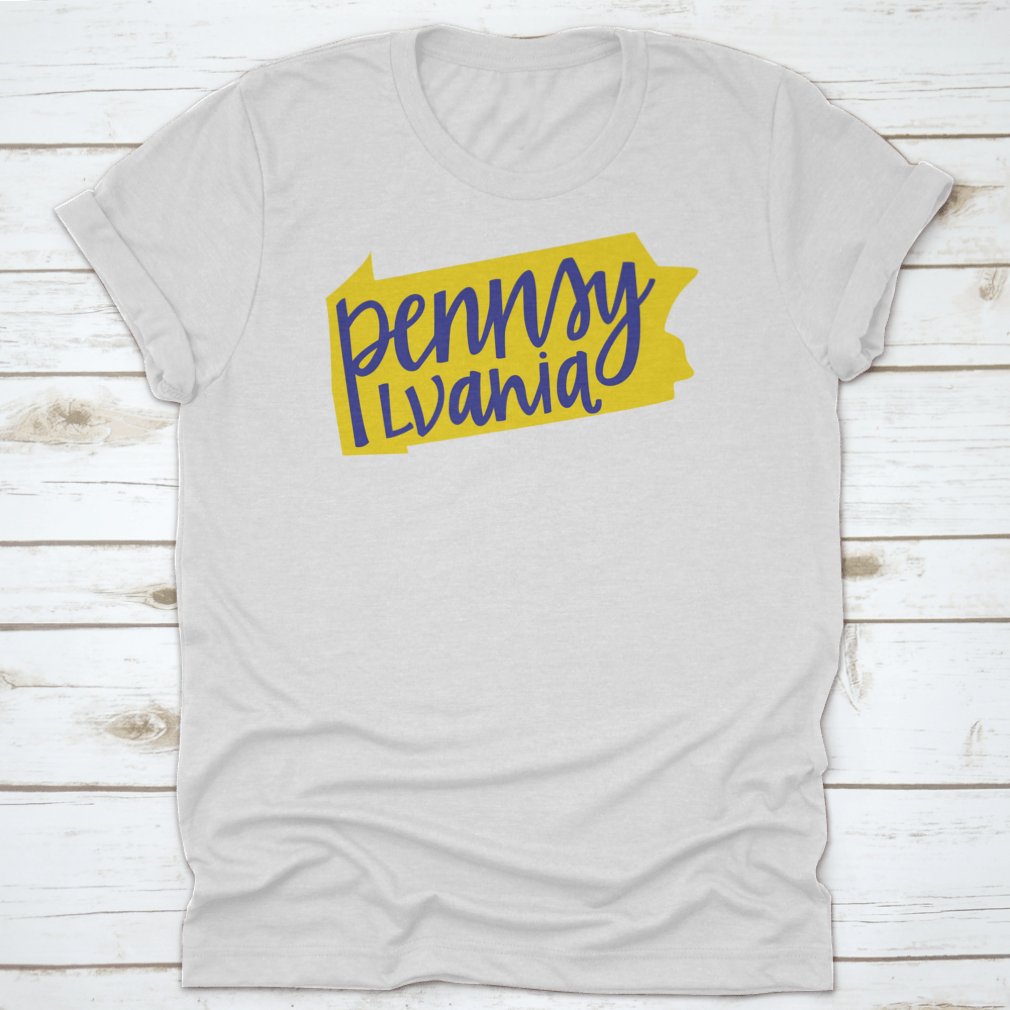 A stylish T-shirt featuring the Pennsylvania state outline and hand lettering design, made from soft cotton fabric.