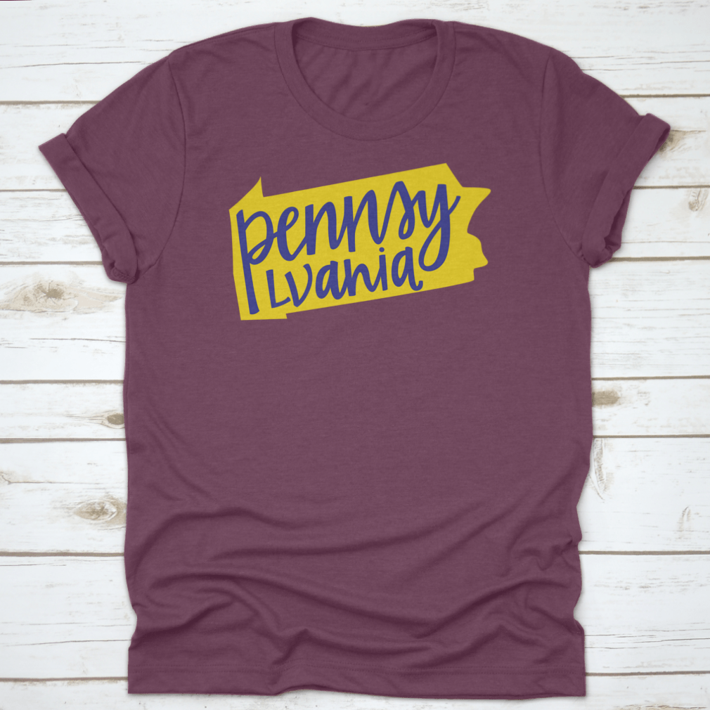 A stylish T-shirt featuring the Pennsylvania state outline and hand lettering design, made from soft cotton fabric.