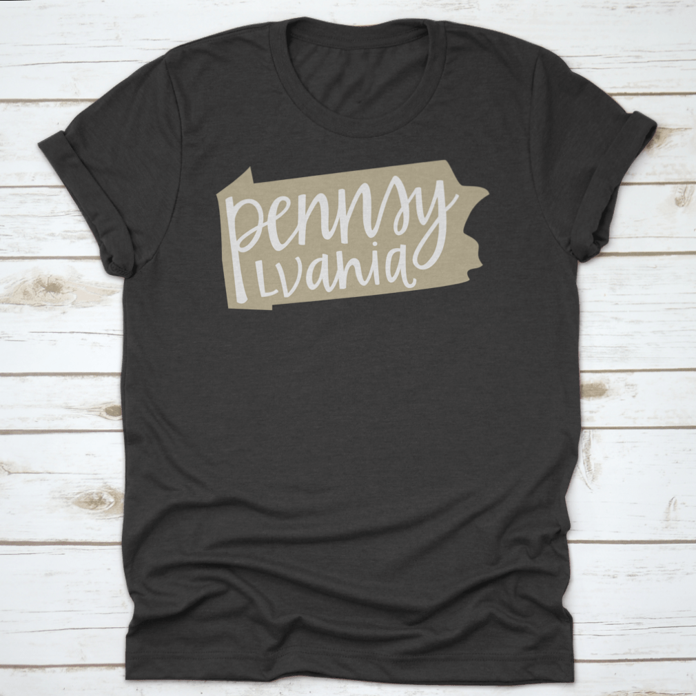 A stylish T-shirt featuring a Pennsylvania state outline and hand-lettering design, made from soft cotton fabric.