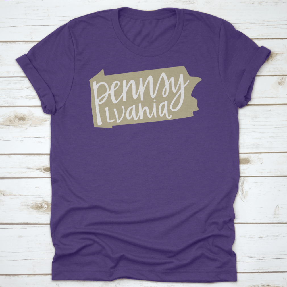 A stylish T-shirt featuring a Pennsylvania state outline and hand-lettering design, made from soft cotton fabric.