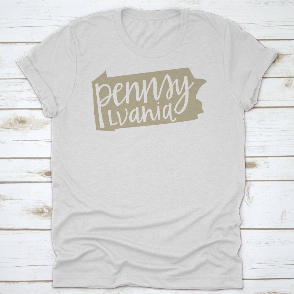 A stylish T-shirt featuring a Pennsylvania state outline and hand-lettering design, made from soft cotton fabric.
