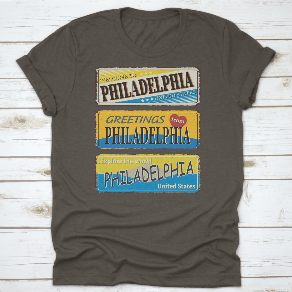 A collection of vintage tin signs featuring retro designs celebrating Philadelphia, showcasing iconic landmarks and city names.
