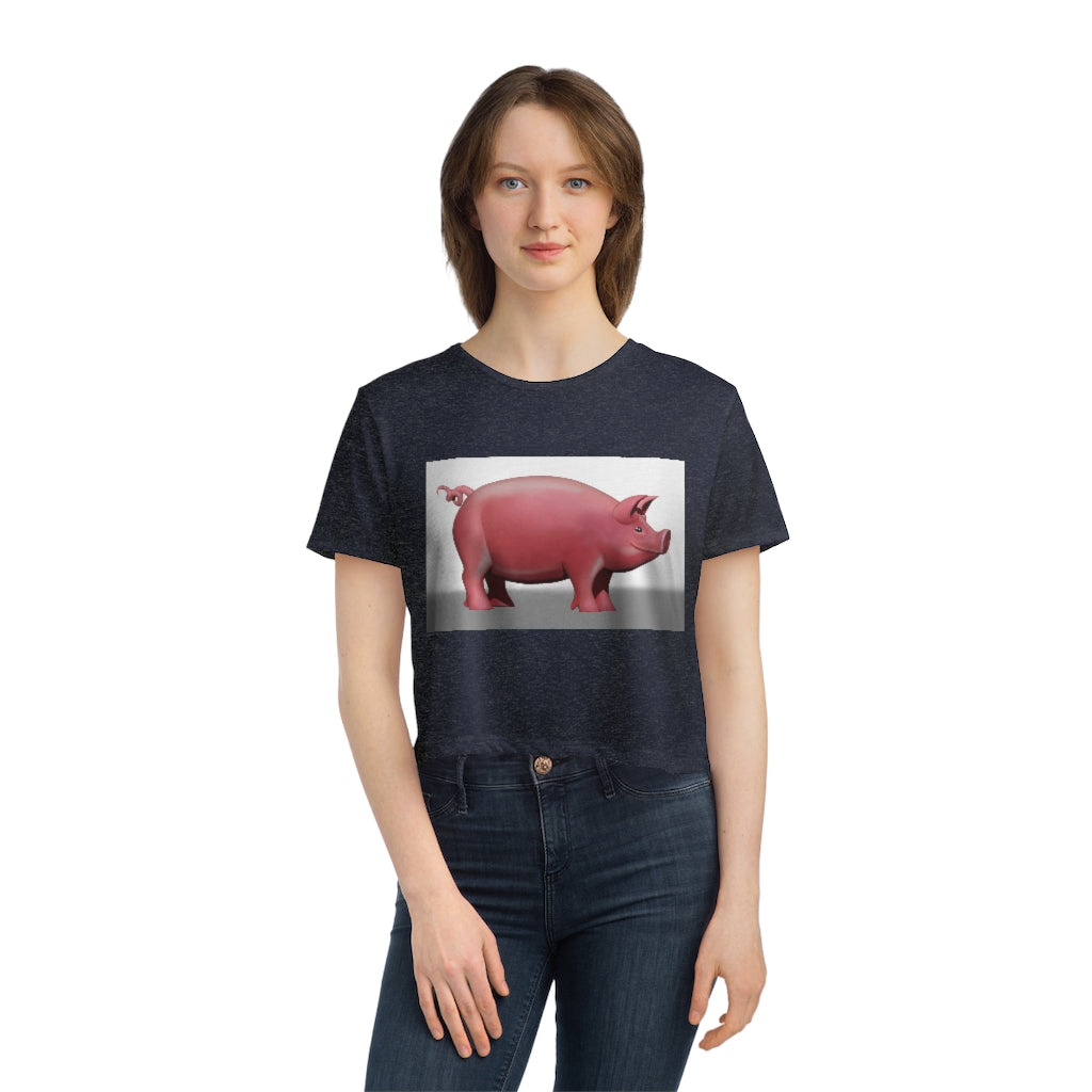 A stylish Pig Women's Flowy Cropped Tee in a light fabric, showcasing its modest crop and flowy fit, perfect for personalized designs.