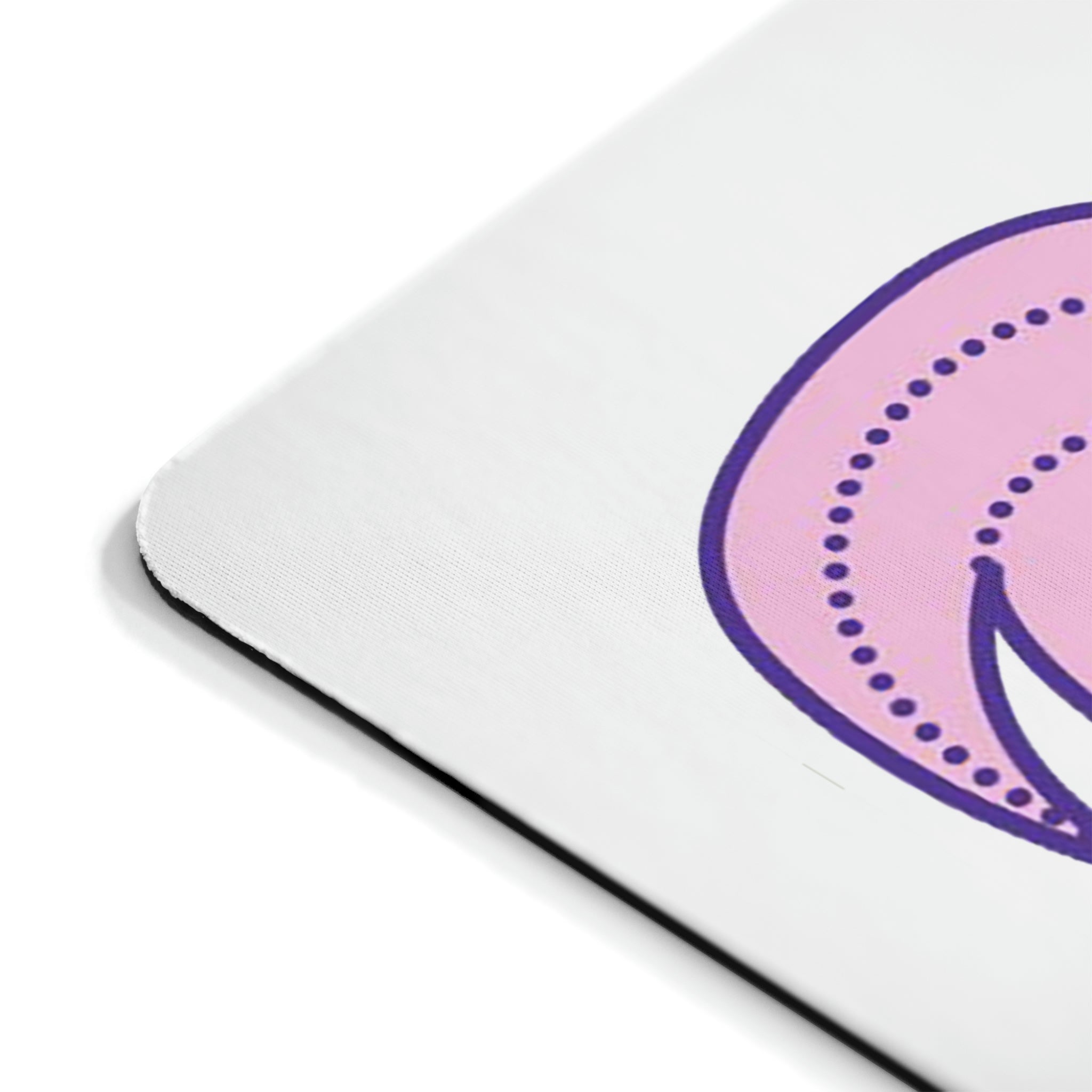 A vibrant pink and purple mouse pad featuring a bird design, perfect for enhancing any workspace.