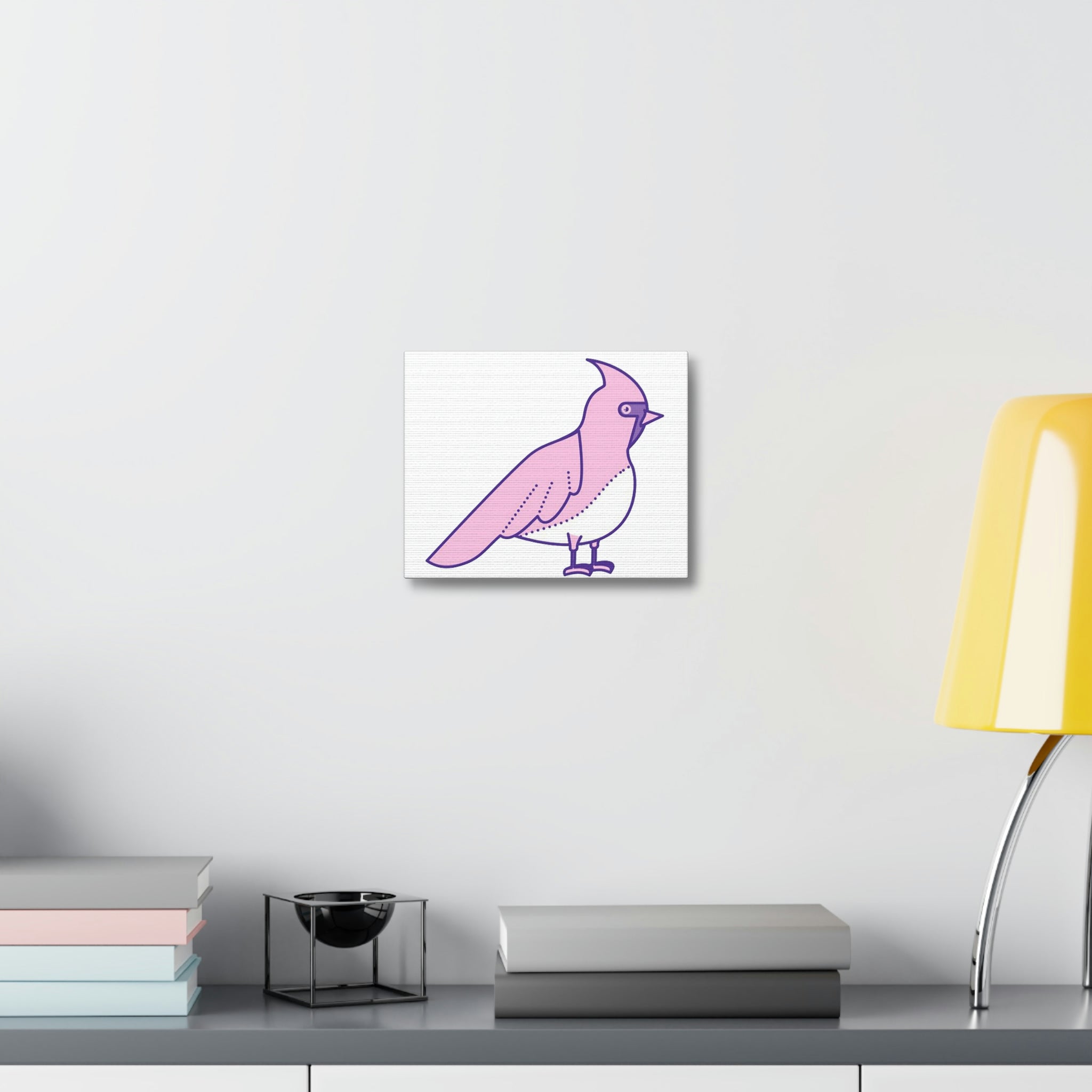 A vibrant pink and purple bird stretched canvas artwork, elegantly framed and ready for indoor display.