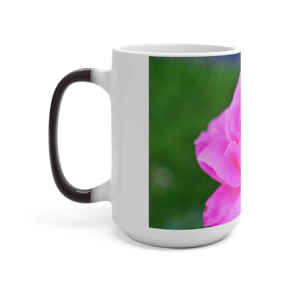 A pink flower color changing mug showcasing vibrant colors when filled with hot liquid, featuring a C-handle and rounded corners.
