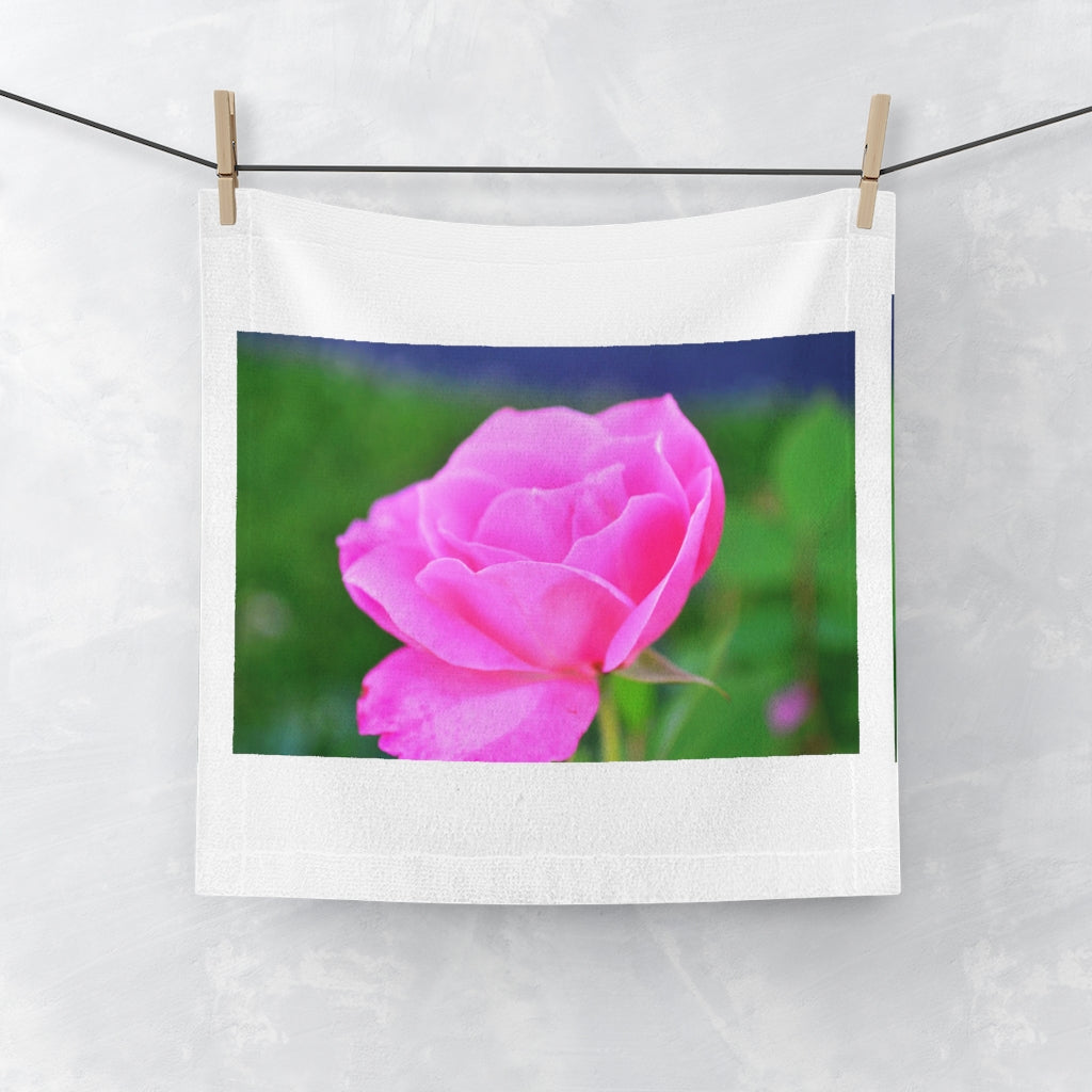 A soft and colorful Pink Flower Face Towel featuring a vibrant floral design on a polyester blend front and a plush cotton back.