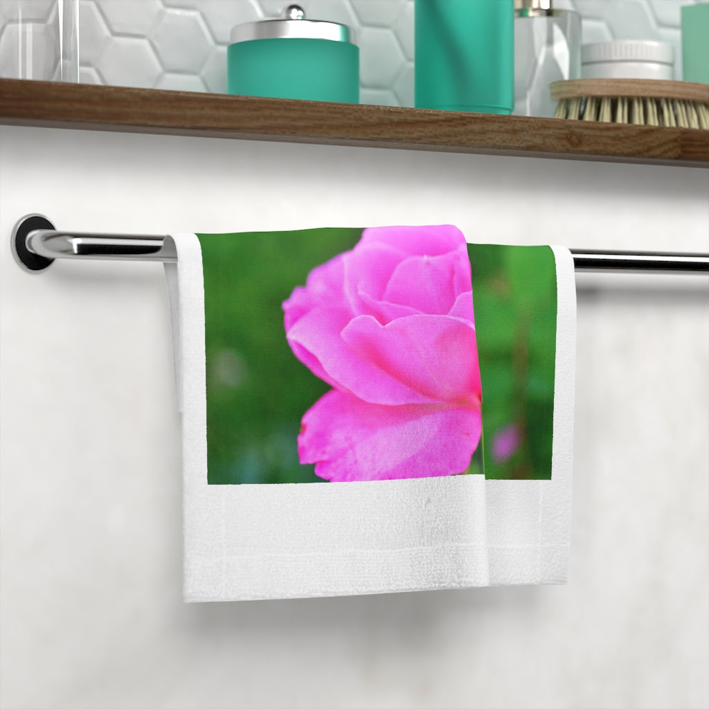 A soft and colorful Pink Flower Face Towel featuring a vibrant floral design on a polyester blend front and a plush cotton back.