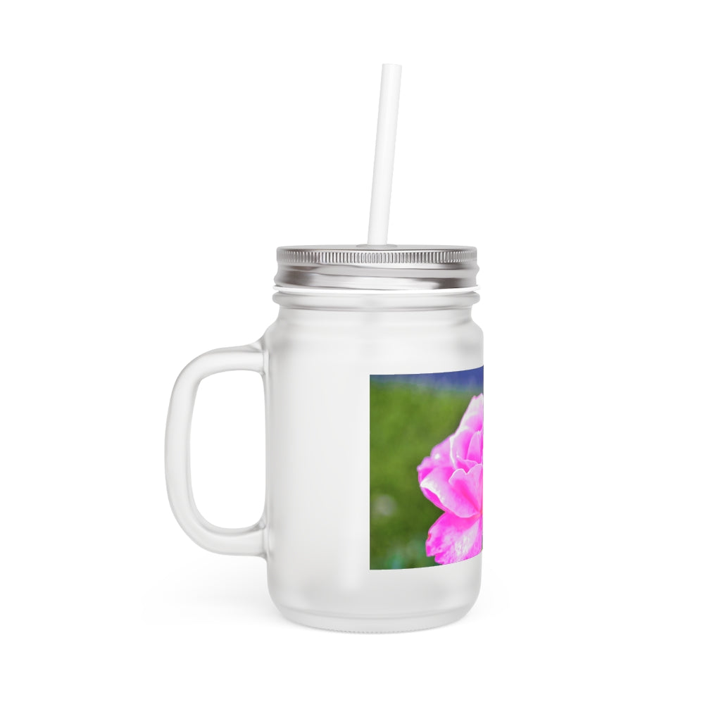 A stylish Pink Flower Mason Jar made of frosted glass, featuring a lid and straw, perfect for personalized drinks.
