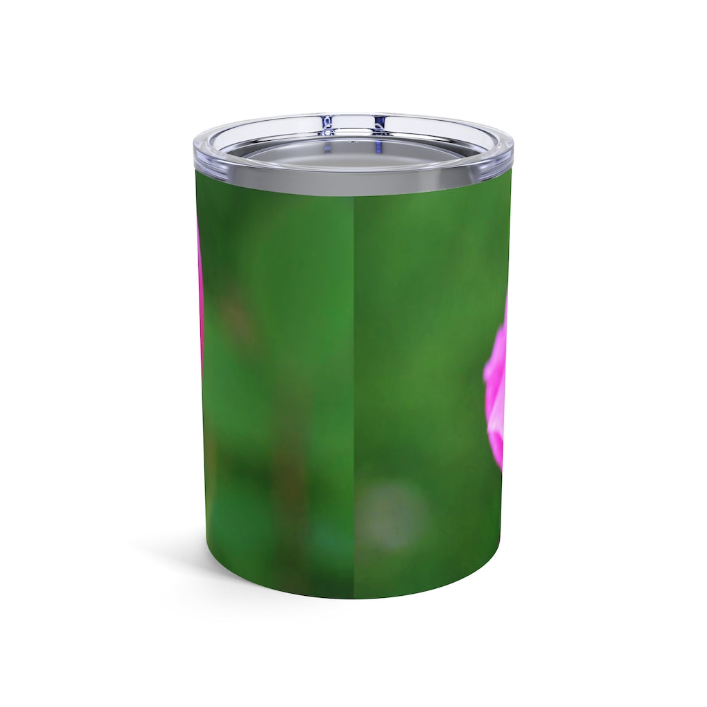 A stylish 10oz pink flower tumbler made of stainless steel with a see-thru plastic lid, showcasing a vibrant floral design.