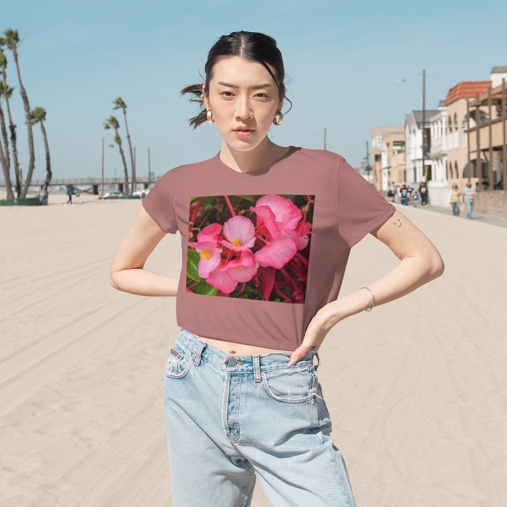 A stylish Pink Flowers Women's Flowy Cropped Tee featuring a soft fabric blend and a modest crop design, perfect for personalized fashion.