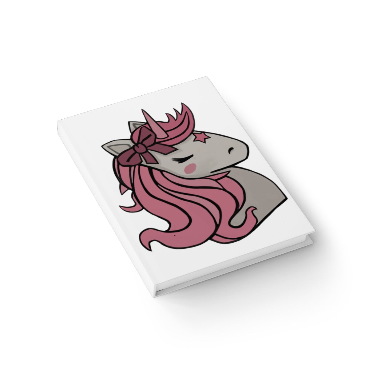 A hardcover journal featuring a whimsical pink hair unicorn design, showcasing a durable wraparound print and ruled line pages.