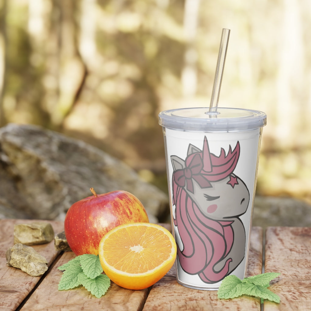 A vibrant pink plastic tumbler featuring a unicorn design, complete with a straw and lid, perfect for drinks at parties and events.