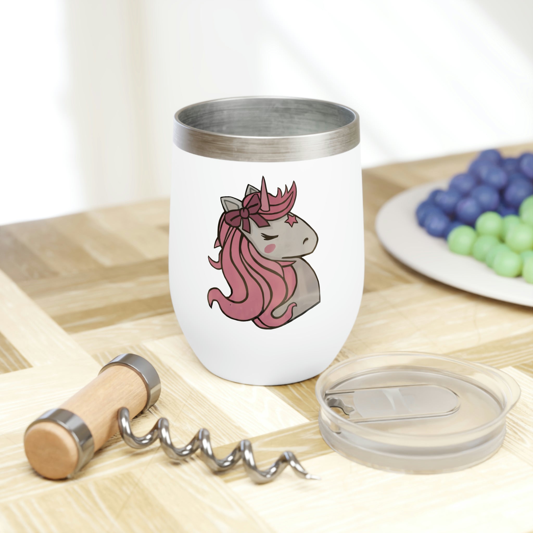 A stylish pink wine tumbler featuring a whimsical unicorn head design, perfect for enjoying beverages at the ideal temperature.