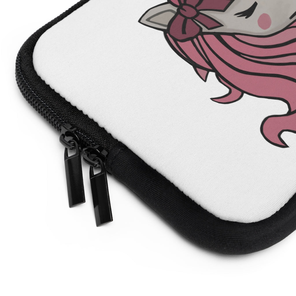 A stylish pink laptop sleeve featuring a unicorn head design, made from smooth neoprene with a black back.