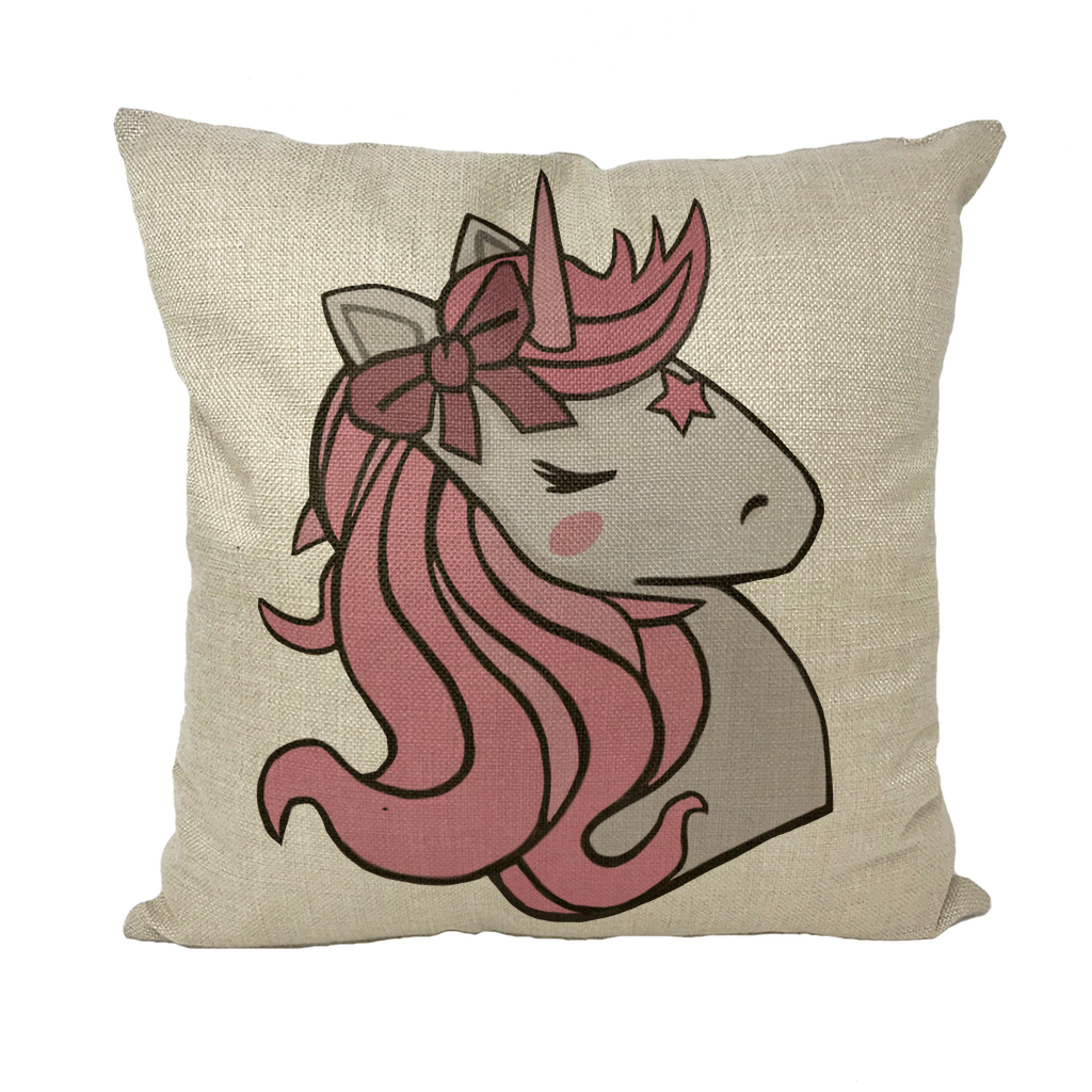 A vibrant pink throw pillow featuring a whimsical unicorn design, perfect for home decor.