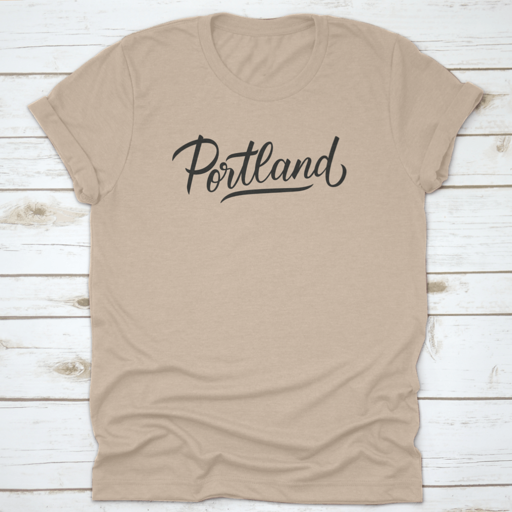 A stylish Portland Handwritten Inscription T-shirt featuring a hand-drawn city name design, made from soft cotton fabric.