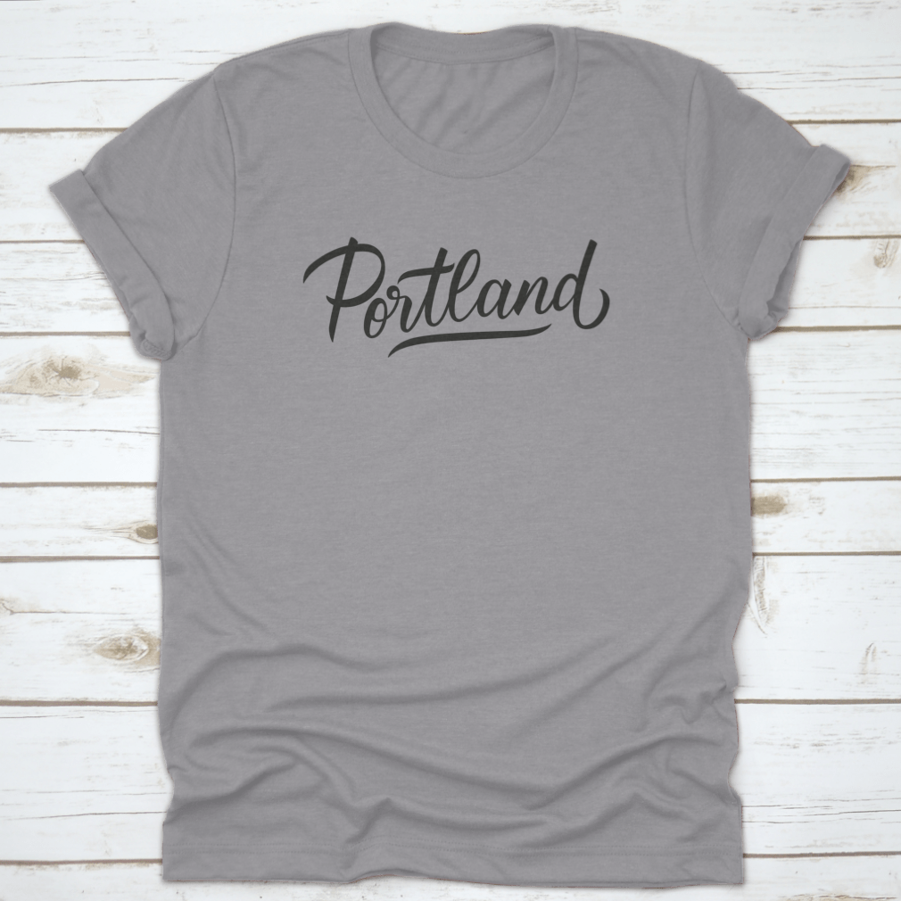 A stylish Portland Handwritten Inscription T-shirt featuring a hand-drawn city name design, made from soft cotton fabric.