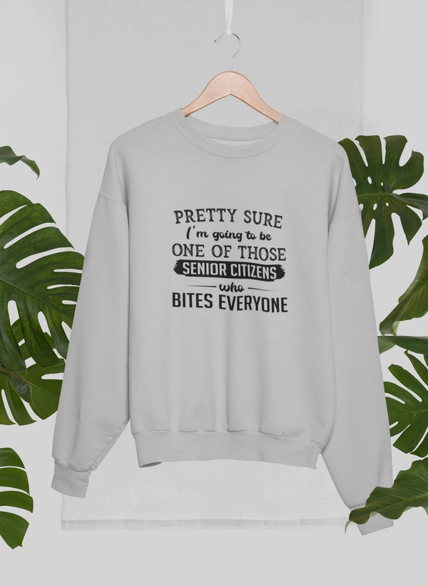 A comfortable and humorous tee shirt featuring the phrase 'Pretty Sure I'm Going To Be One Of Those Senior Citizens Who Bites', made from soft ring-spun cotton.