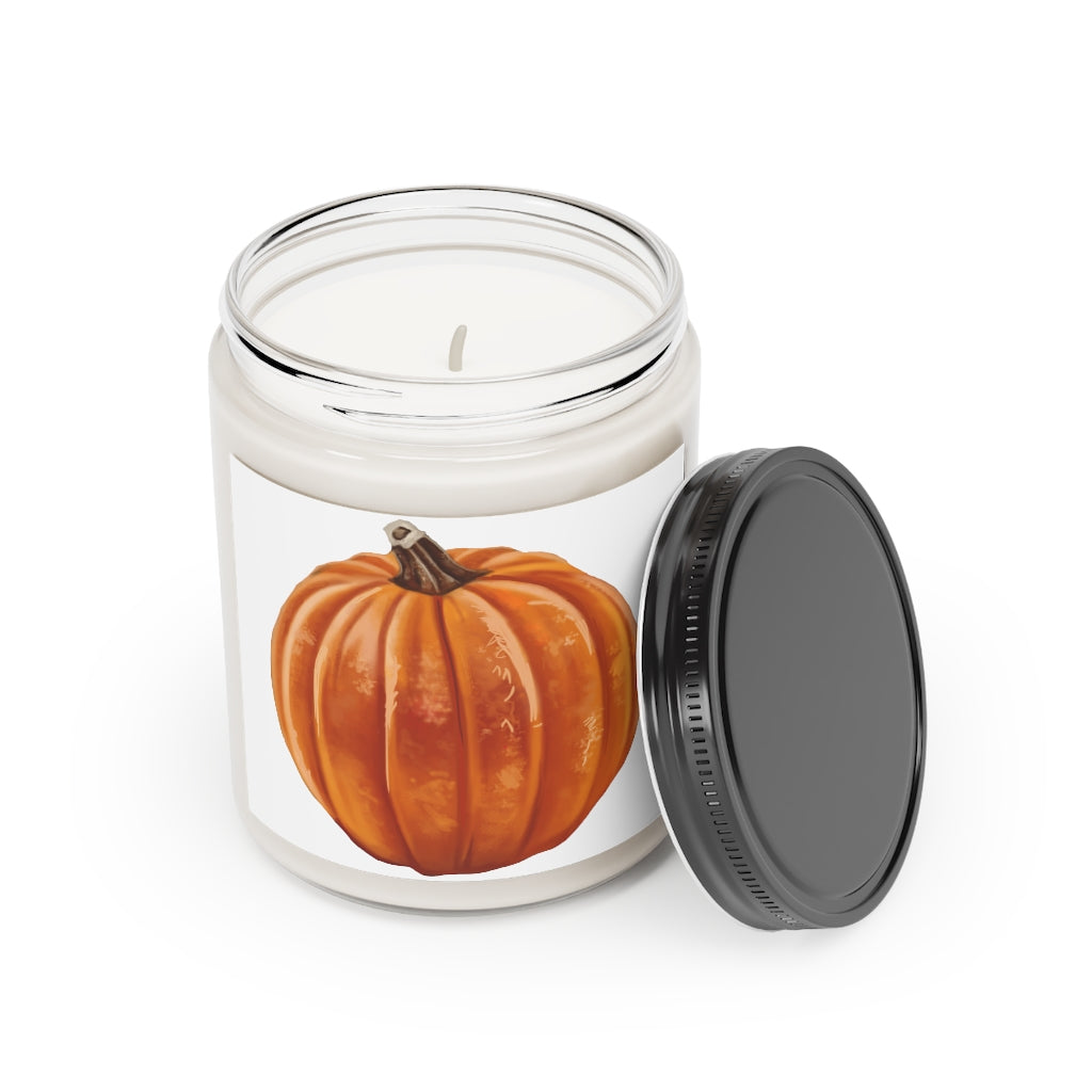 A beautifully crafted Pumpkin Scented Candle in a glass container, showcasing its warm orange hue and elegant label.