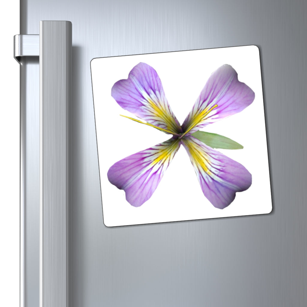 A set of vibrant purple flower magnets displayed on a metallic surface, showcasing their design and colors.