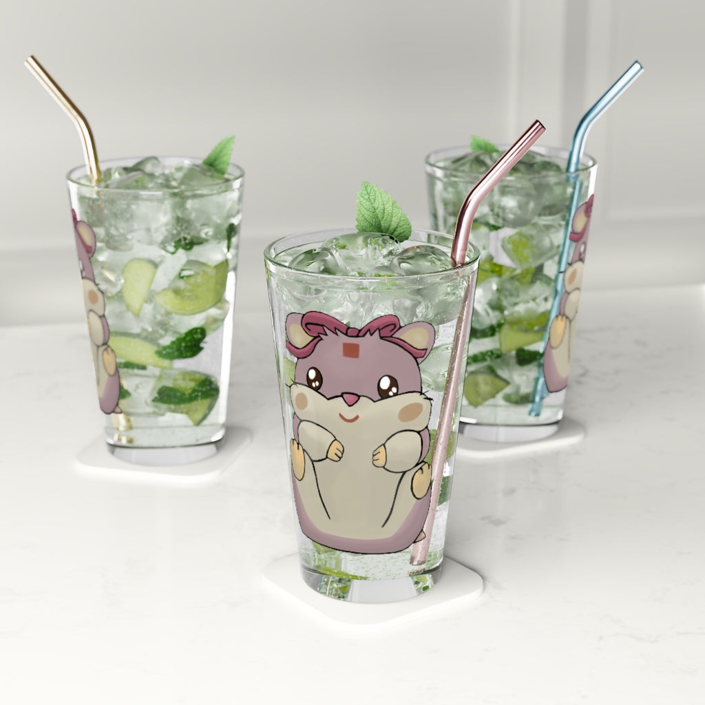 A clear 16oz Purple Hamster Pint Glass showcasing a custom printed design, perfect for beverages.