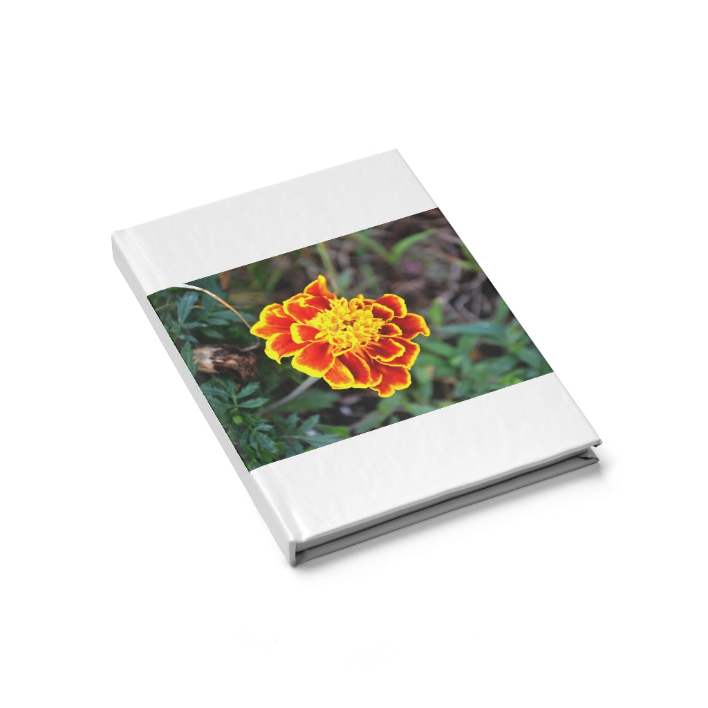 A vibrant red and yellow flower journal with a hardcover, featuring a wraparound print and blank pages for creativity.