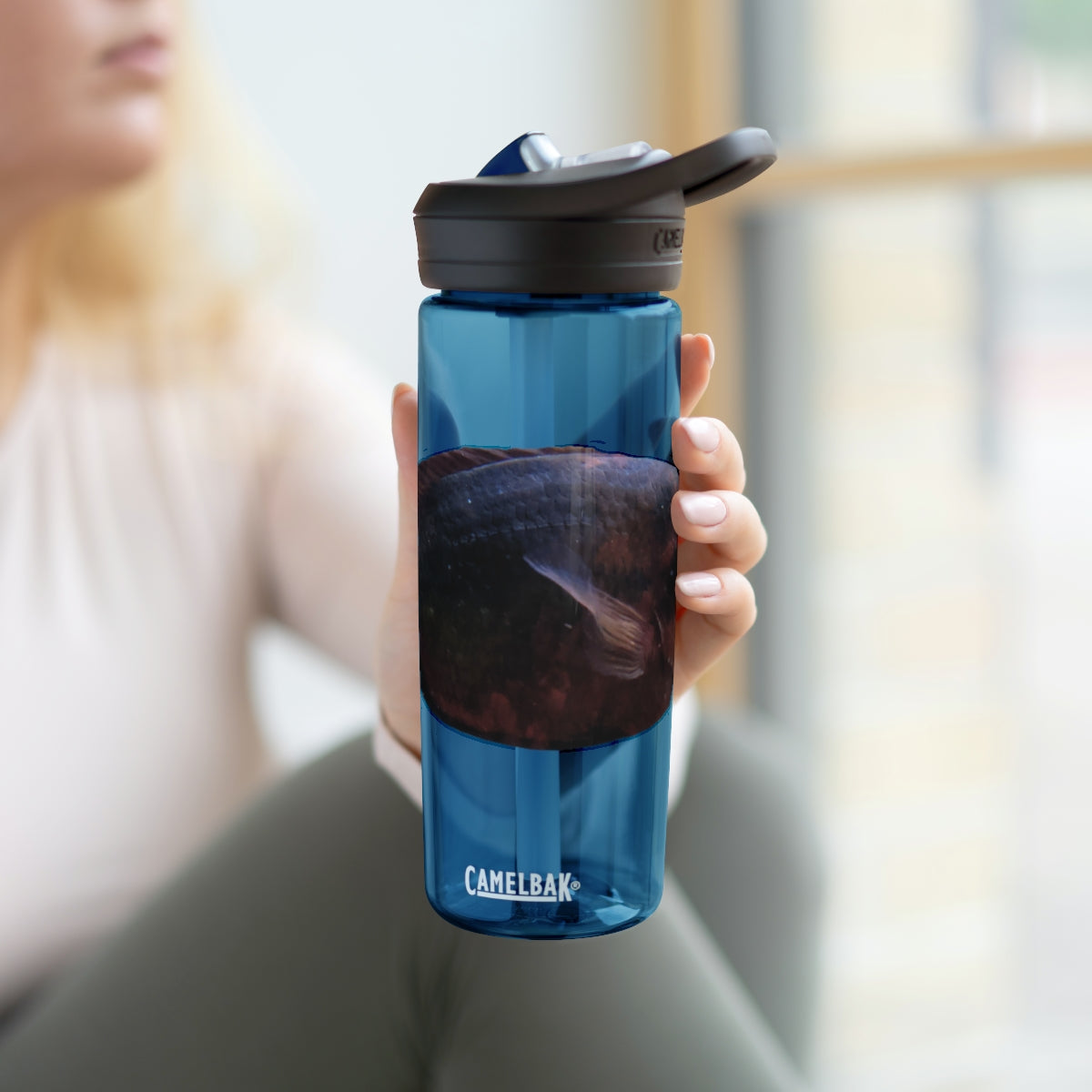 Red Black CamelBak Eddy® Water Bottle in 20oz and 25oz sizes, showcasing its durable design and spill-proof valve.